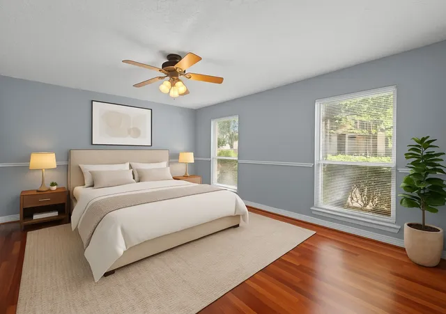 a spacious bedroom with a bed and a window