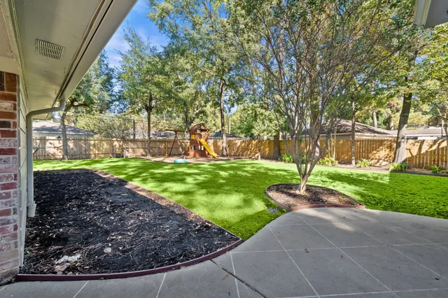a view of a garden with a fountain