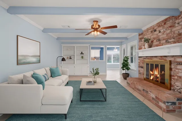 a living room with furniture and a fireplace