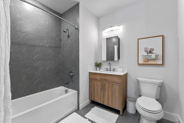 a bathroom with a toilet sink and bathtub