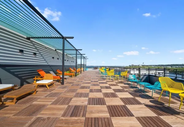 a view of a balcony with chairs