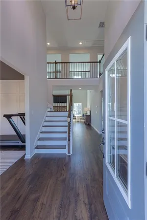 a bedroom with a bed and a ceiling fan
