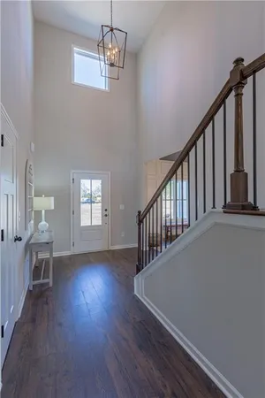 a view of an empty room and closet area