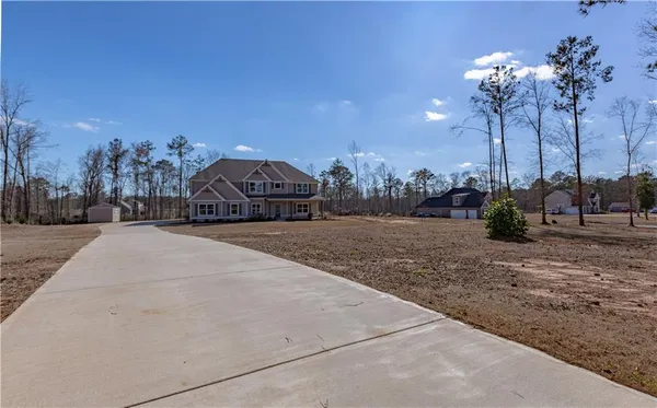 a view of entryway with wooden floor and stairs