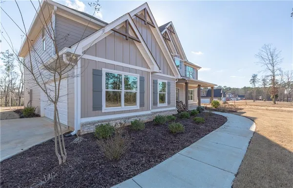 a view of a dining room with furniture wooden floor and fan