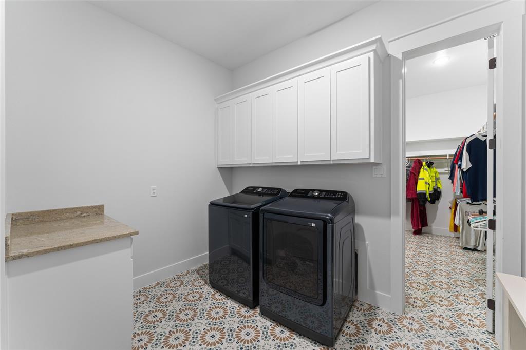 4411 Fm 751 Wills Point Wills Point, TX 75169 - Photo 35 of 40 Laundry area featuring patterned tile flooring, a granite-finish countertop, and white shaker-style cabinetry