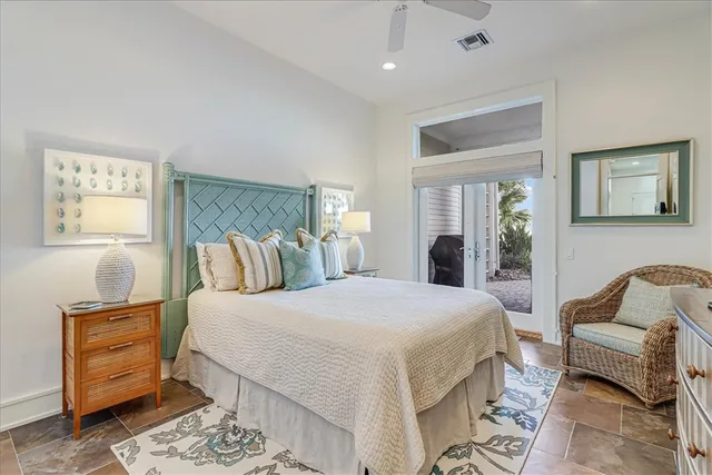 a bathroom with a granite countertop sink toilet a large mirror a bathtub and shower