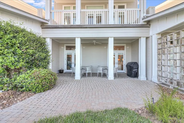 a front view of a residential apartment building with a yard