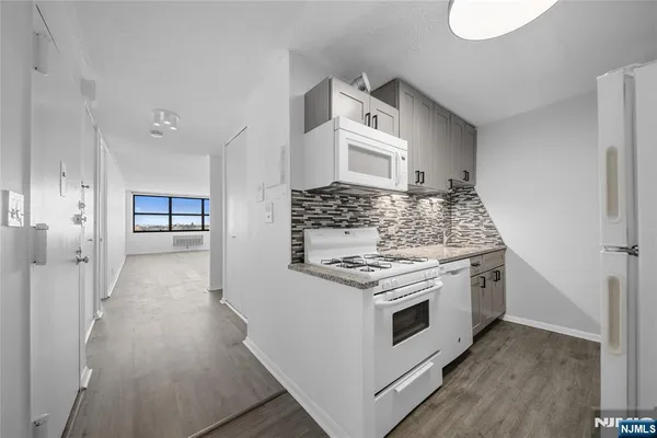 a kitchen with a stove and a microwave