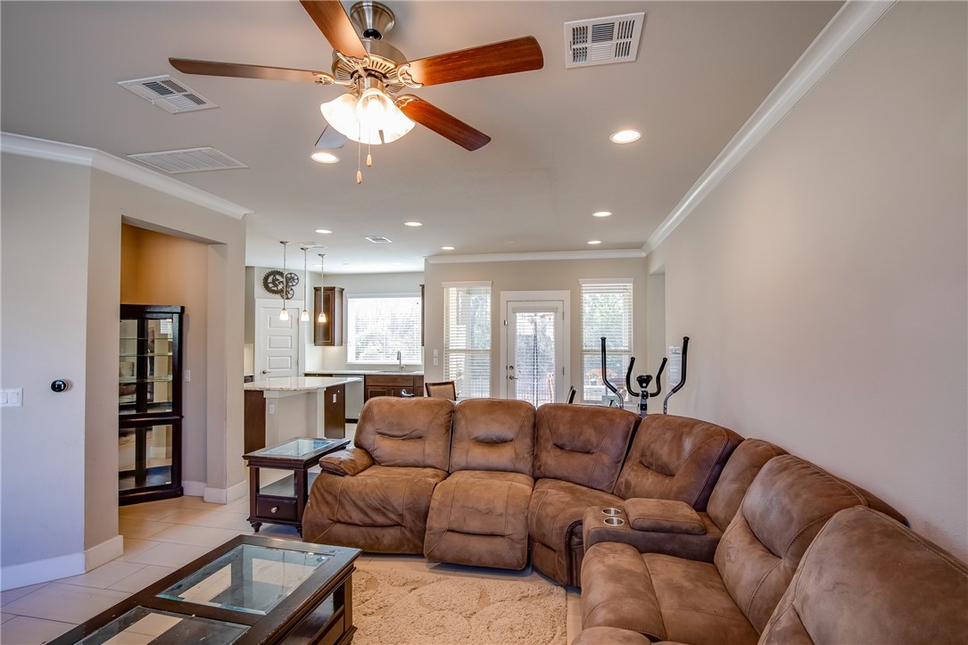 9707 McKnight Loop Austin, TX 78717 - Photo 4 of 17 a living room with furniture and a chandelier