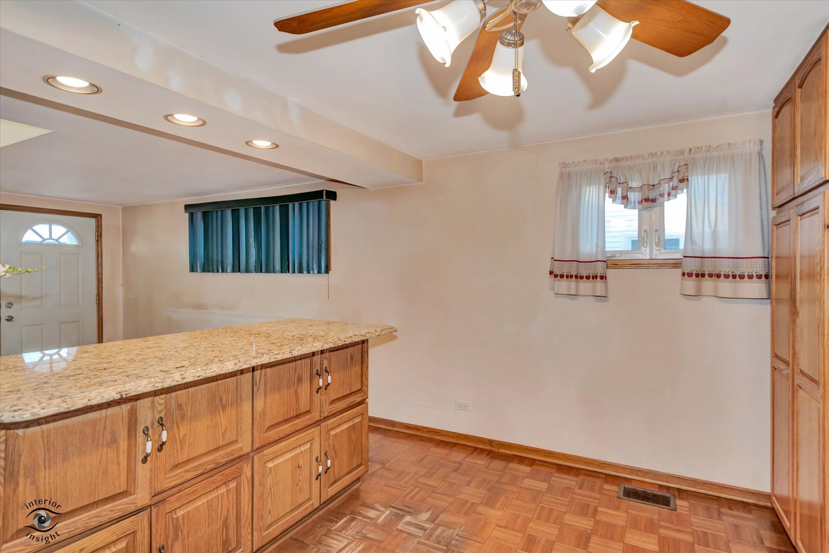 8859 South Main Street Hometown, IL 60456 - Photo 11 of 26 a room with kitchen island a chandelier and wooden floor