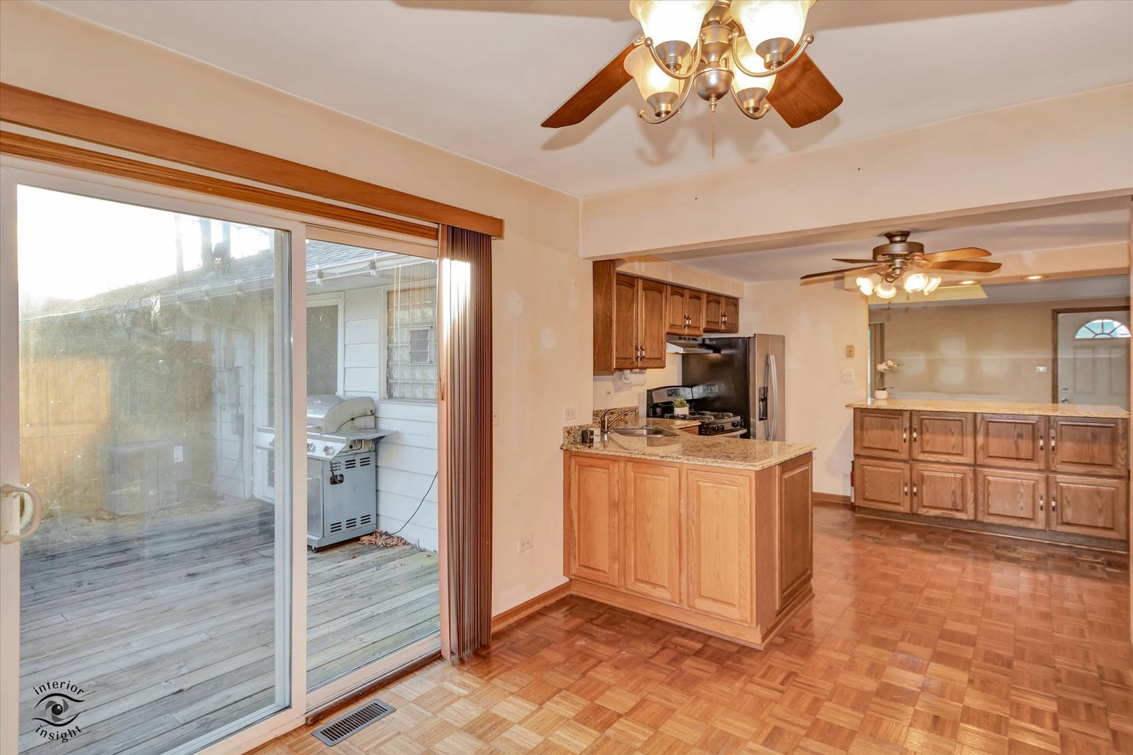 8859 South Main Street Hometown, IL 60456 - Photo 13 of 26 a kitchen with stainless steel appliances kitchen island granite countertop a sink and cabinets