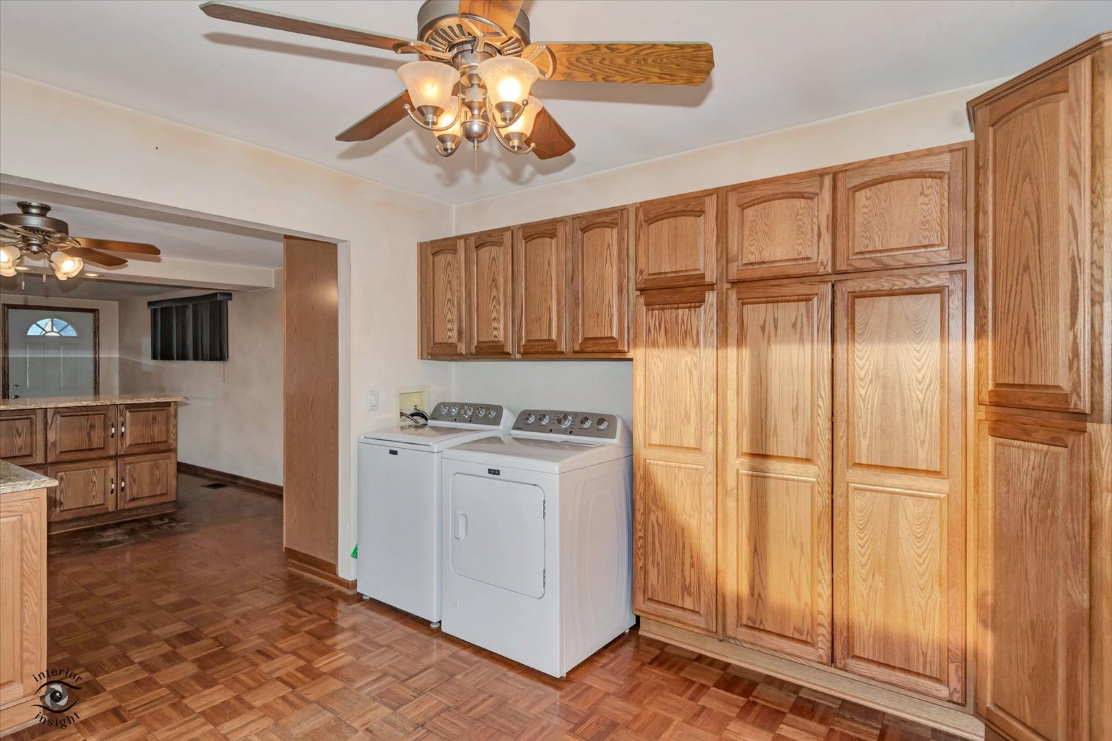 8859 South Main Street Hometown, IL 60456 - Photo 14 of 26 a kitchen with stainless steel appliances granite countertop a refrigerator a sink dishwasher a dining table and chairs with wooden floor