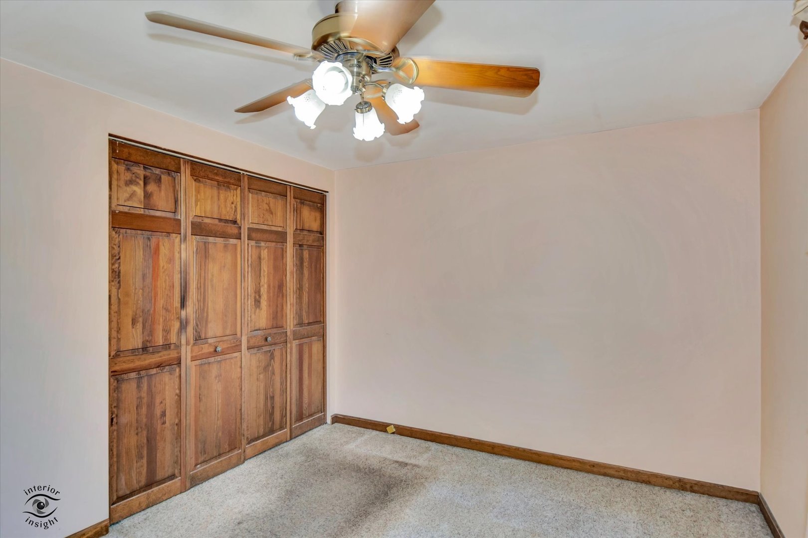 8859 South Main Street Hometown, IL 60456 - Photo 17 of 26 an empty room with chandelier fan