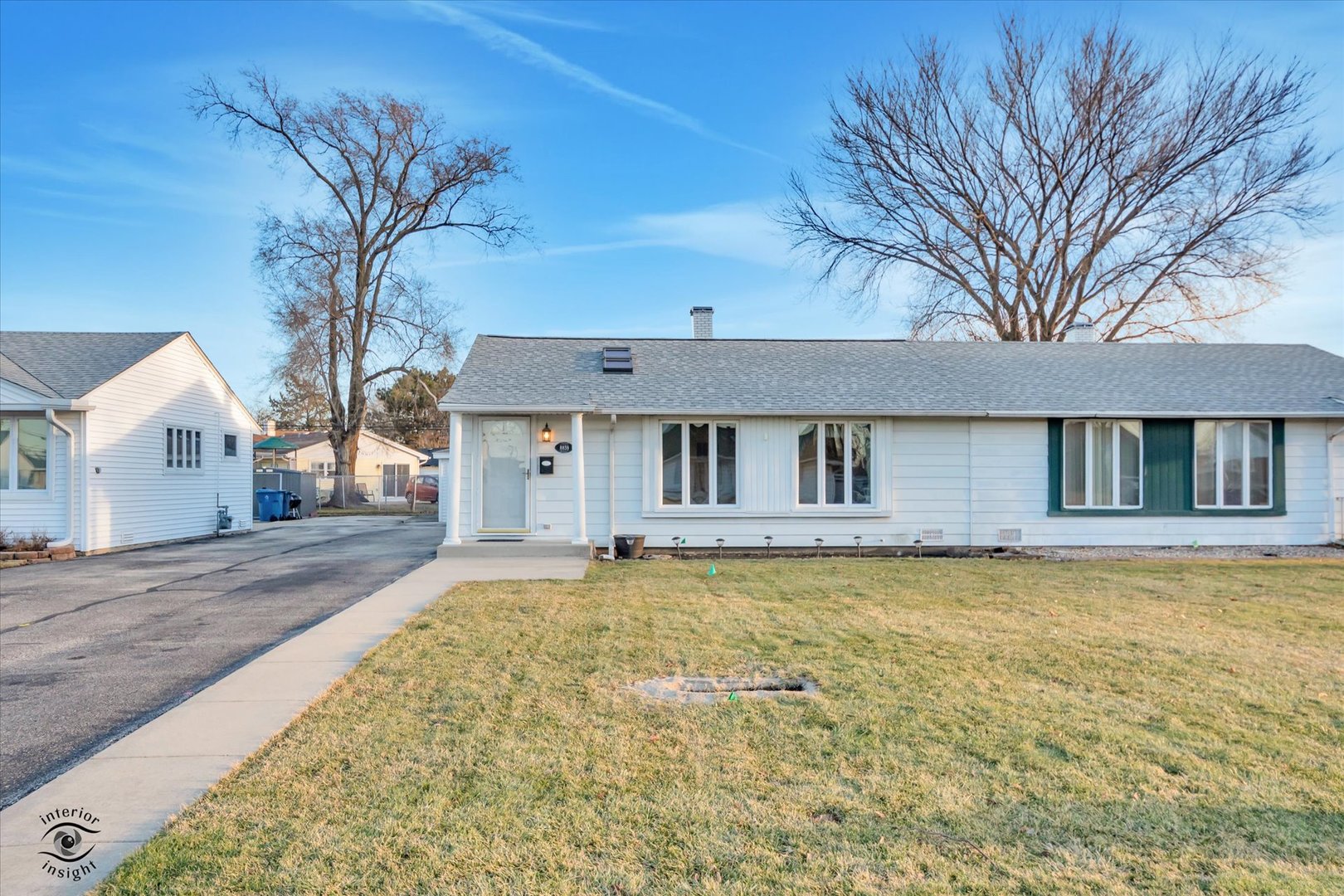 8859 South Main Street Hometown, IL 60456 - Photo 2 of 26 a view of a house with a large tree and wooden fence