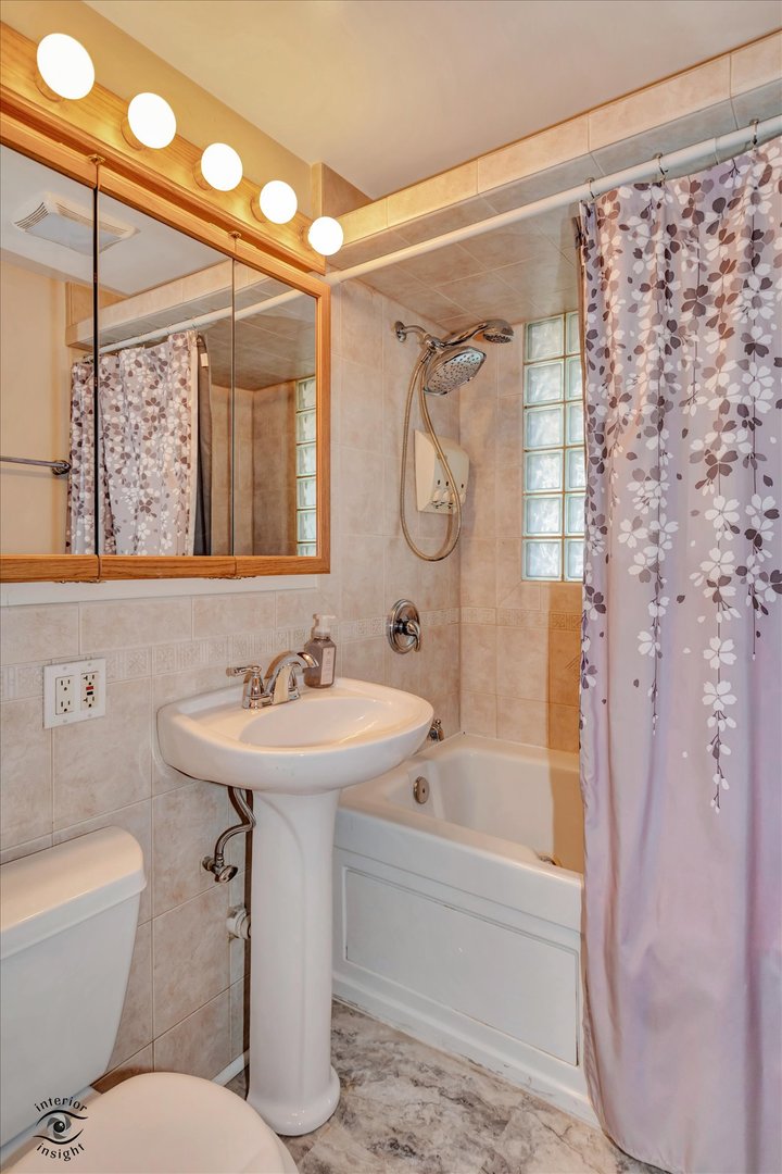 8859 South Main Street Hometown, IL 60456 - Photo 21 of 26 a bathroom with a sink mirror toilet and bathtub