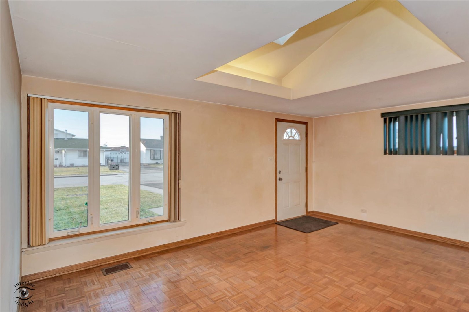 8859 South Main Street Hometown, IL 60456 - Photo 5 of 26 a view of an empty room with windows