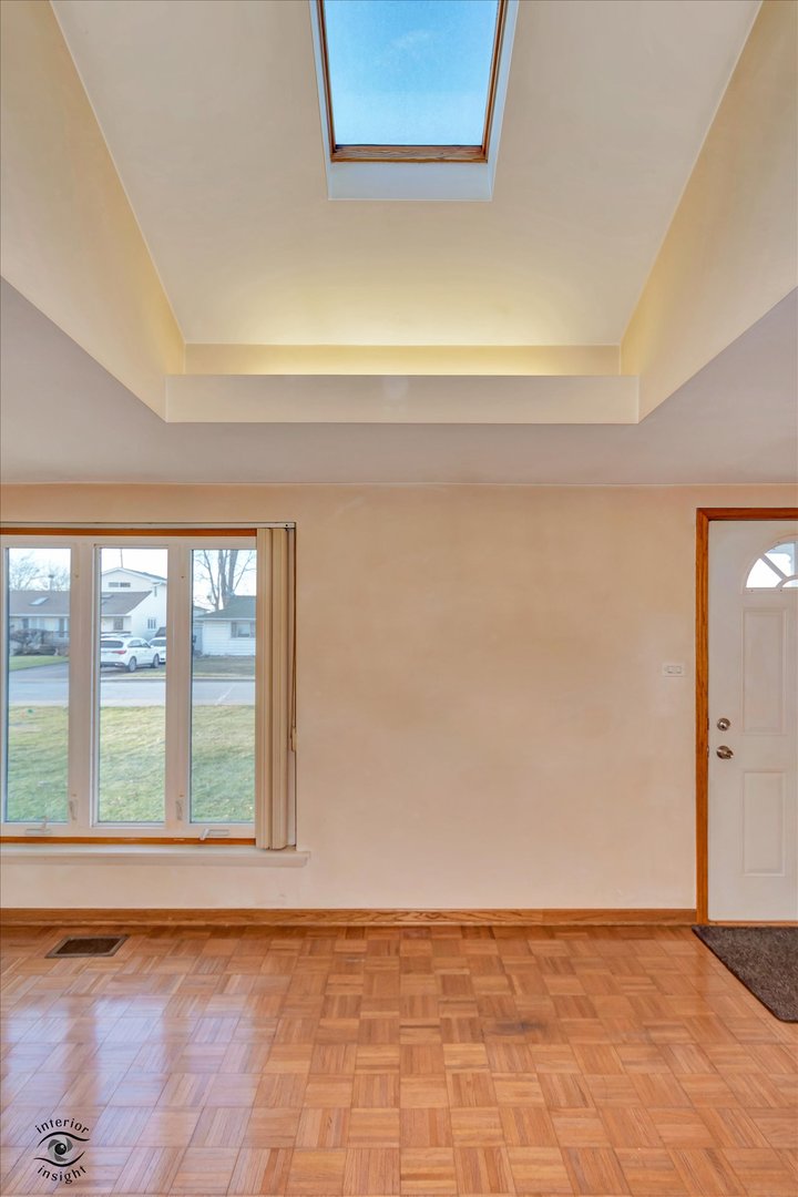 8859 South Main Street Hometown, IL 60456 - Photo 8 of 26 a view of an empty room with a window