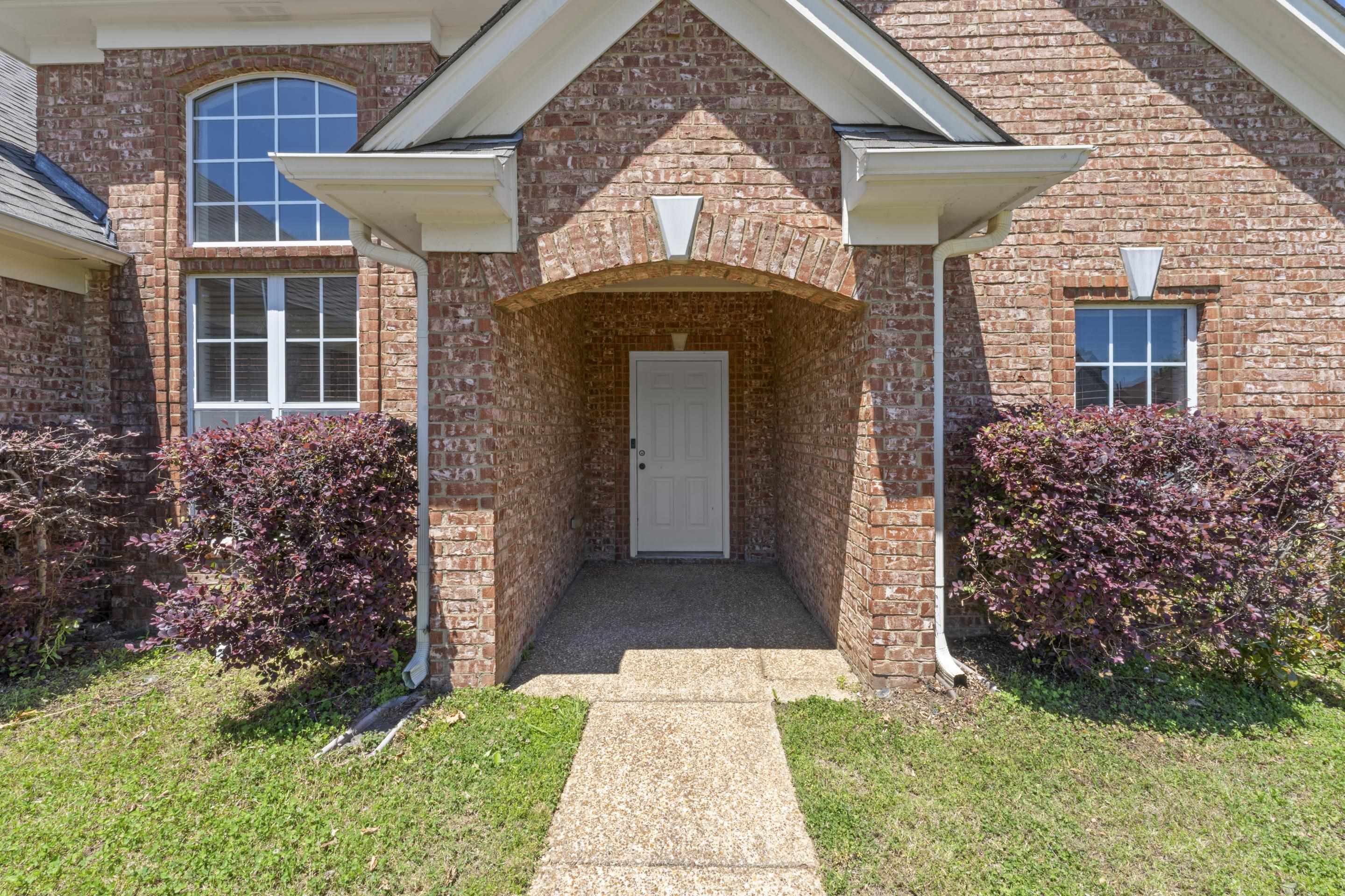 50 Abbey Road Oakland, TN 38060 - Photo 3 of 26 Brick facade home with an arched entry and covered porch