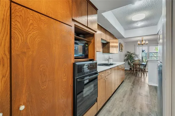 a kitchen with stainless steel appliances granite countertop a refrigerator and a stove