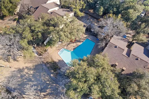 a view of a playground with a tree