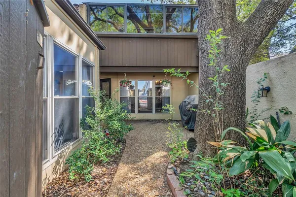 a backyard of a house with lots of green space