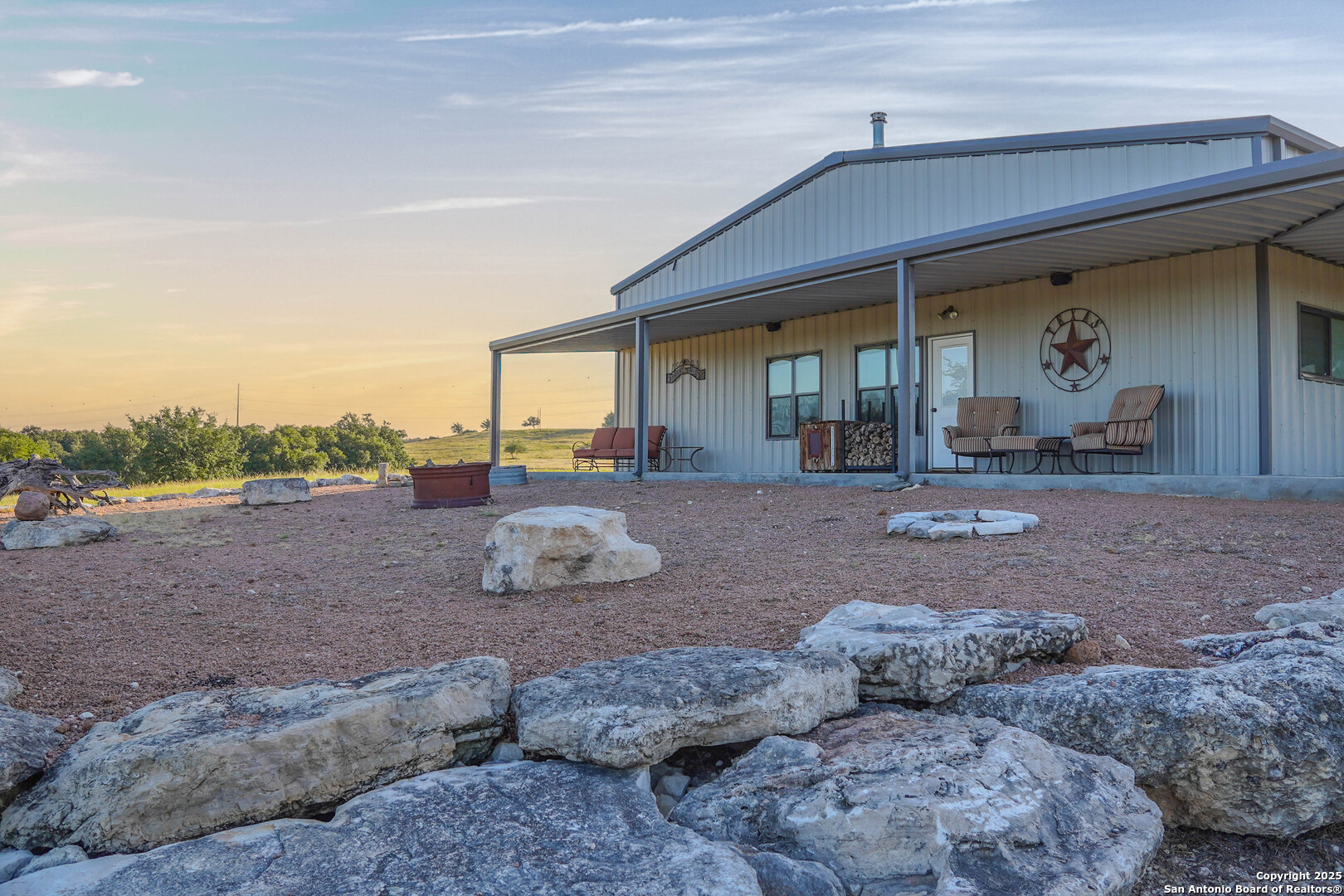 13105 Interstate 10 Service Road Junction, TX 76849 - Photo 28 of 82 a view of a house with backyard porch and outdoor space