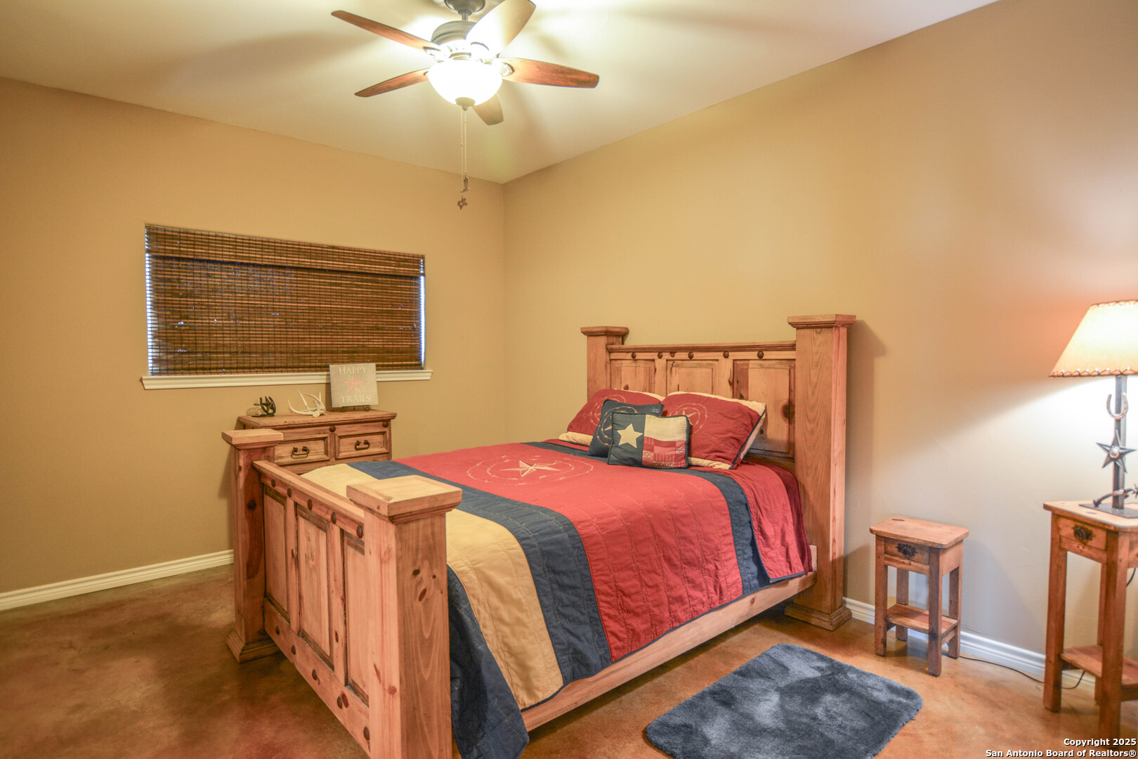 13105 Interstate 10 Service Road Junction, TX 76849 - Photo 34 of 82 a bedroom with a bed and a table in it