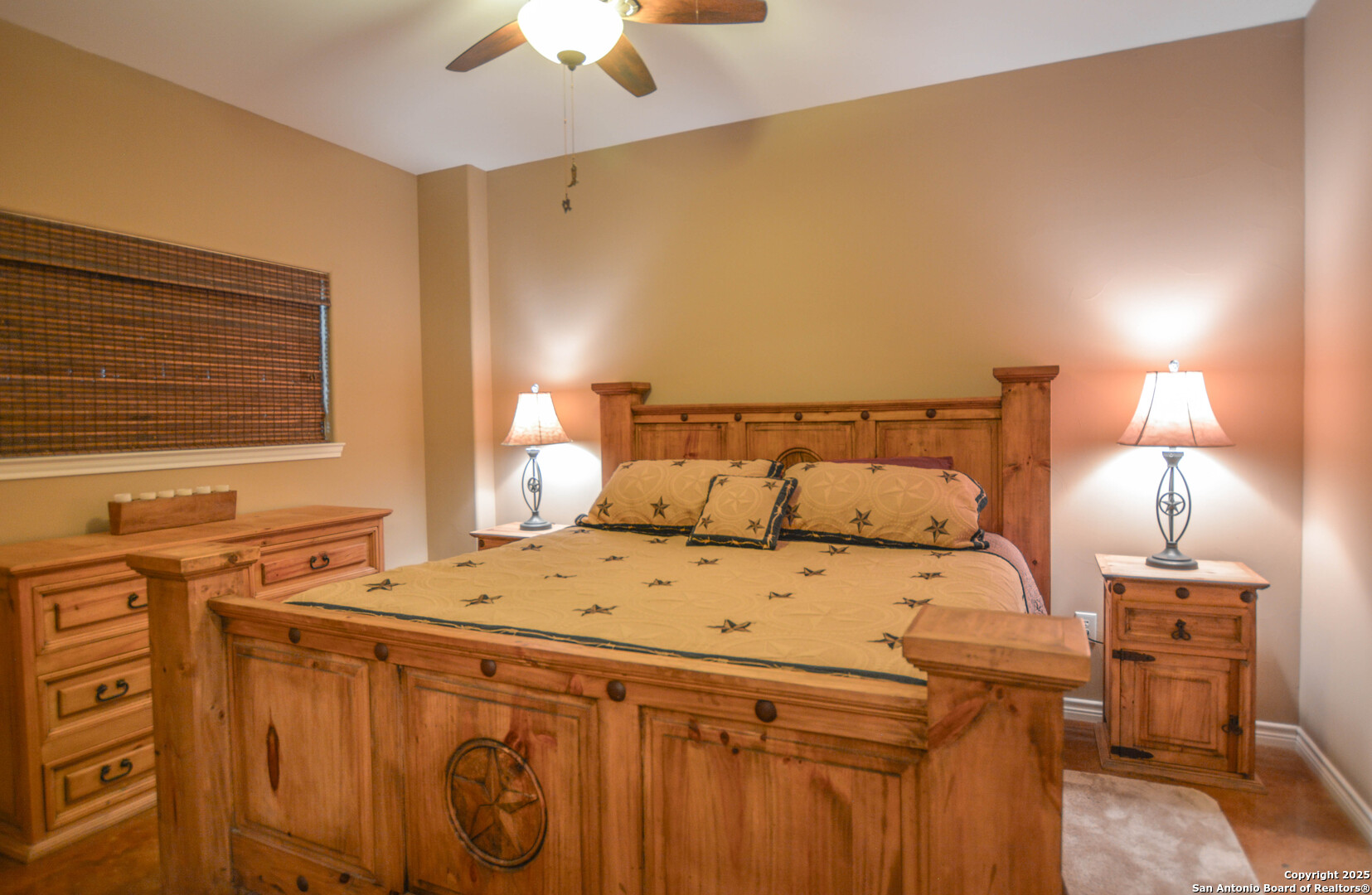 13105 Interstate 10 Service Road Junction, TX 76849 - Photo 39 of 82 a bed sitting in a bedroom next to a lamp