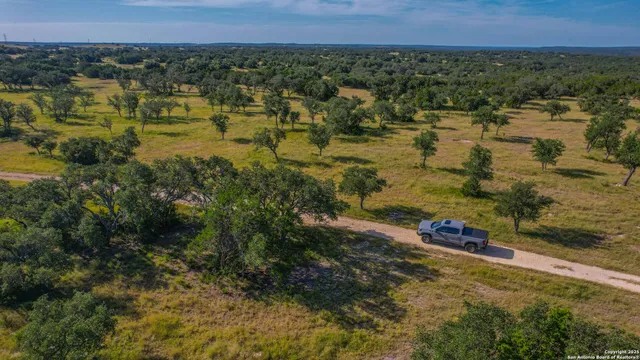 a view of a swimming pool with a yard