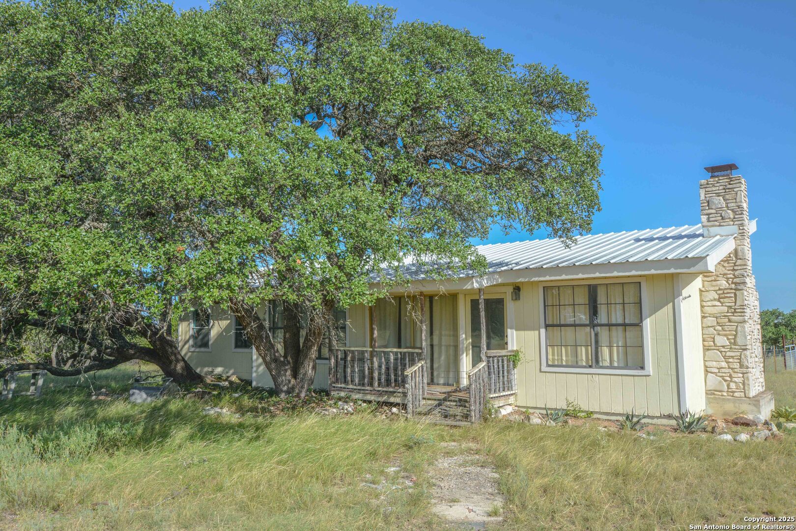 13105 Interstate 10 Service Road Junction, TX 76849 - Photo 78 of 82 a front view of a house with a garden