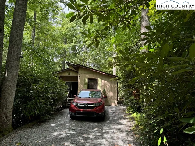a view of a house with a tree