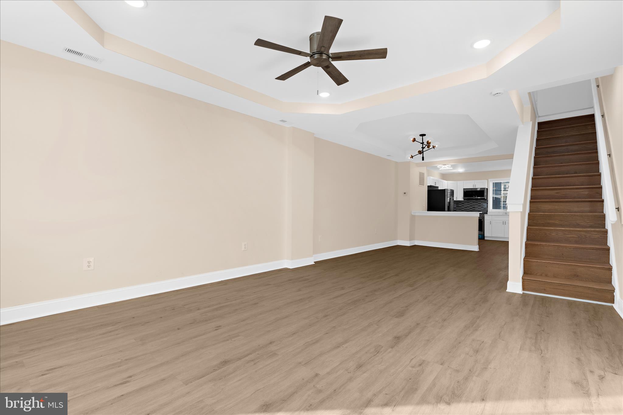 1402 North Montford Avenue Baltimore, MD 21213 - Photo 12 of 40 wooden floor in an empty room with a window