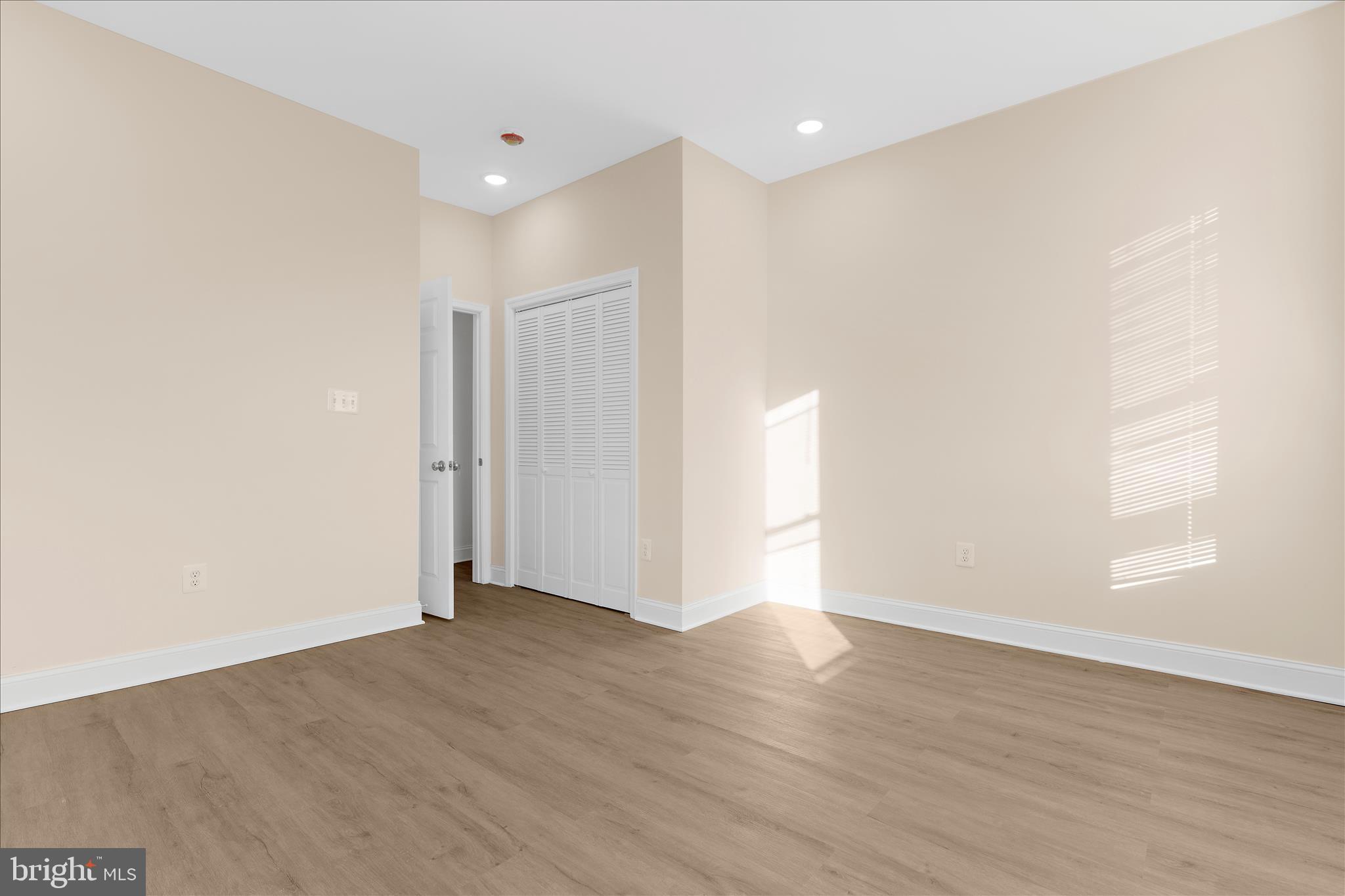 1402 North Montford Avenue Baltimore, MD 21213 - Photo 17 of 40 a view of an empty room with wooden floor