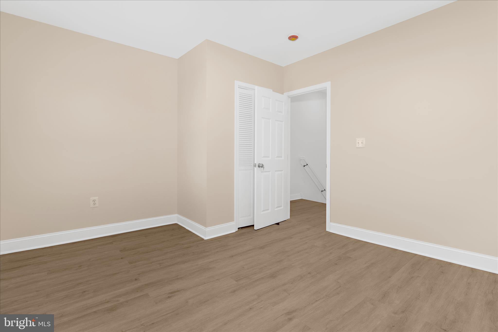 1402 North Montford Avenue Baltimore, MD 21213 - Photo 25 of 40 an empty room with wooden floor