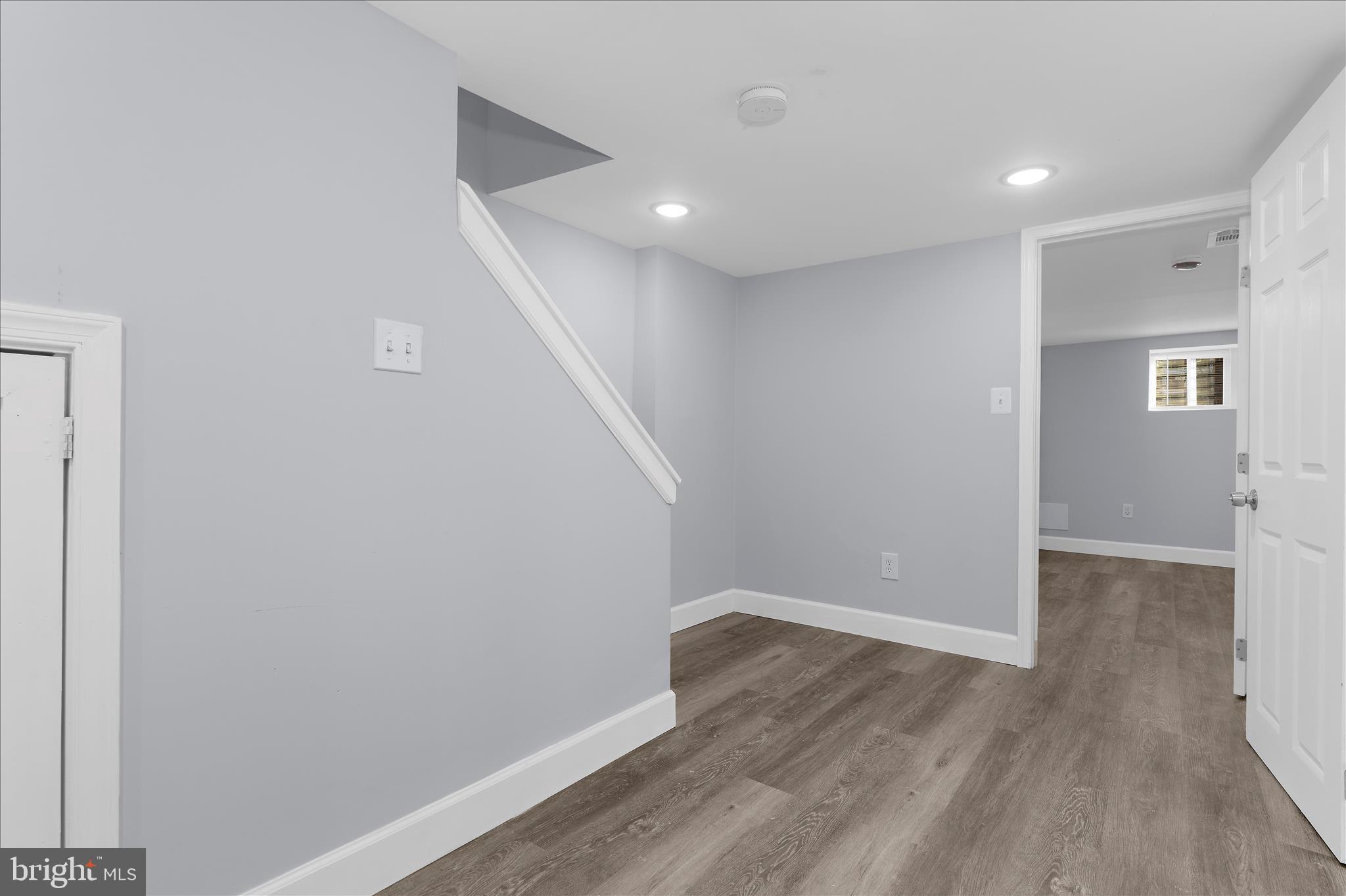 1402 North Montford Avenue Baltimore, MD 21213 - Photo 29 of 40 a view of hallway with wooden floor
