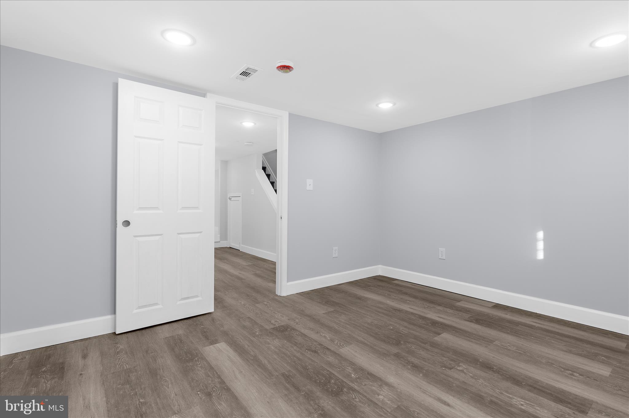 1402 North Montford Avenue Baltimore, MD 21213 - Photo 31 of 40 wooden floor in an empty room
