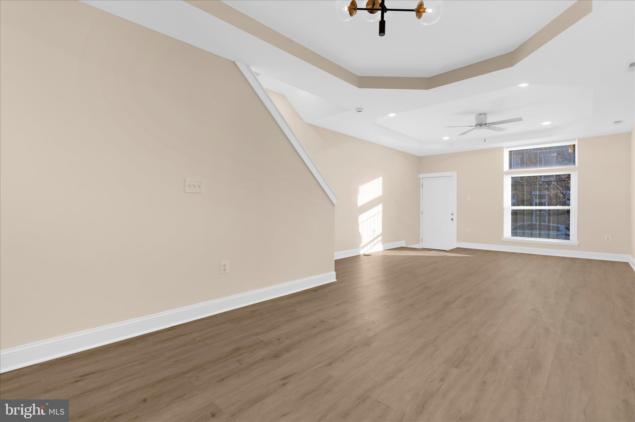 1402 North Montford Avenue Baltimore, MD 21213 - Photo 5 of 40 wooden floor in an empty room with a window