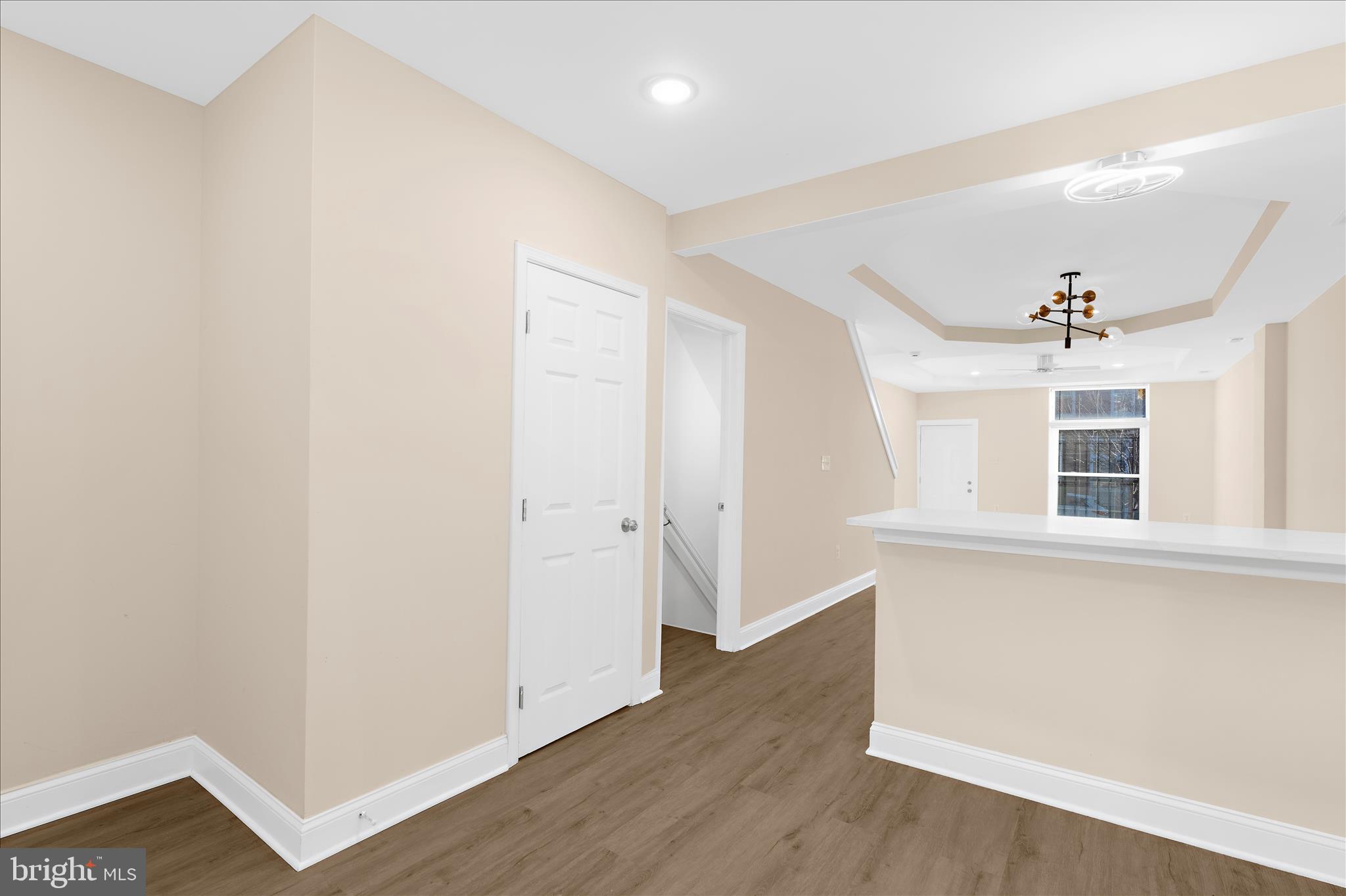 1402 North Montford Avenue Baltimore, MD 21213 - Photo 6 of 40 a view of a kitchen with wooden floor and a window