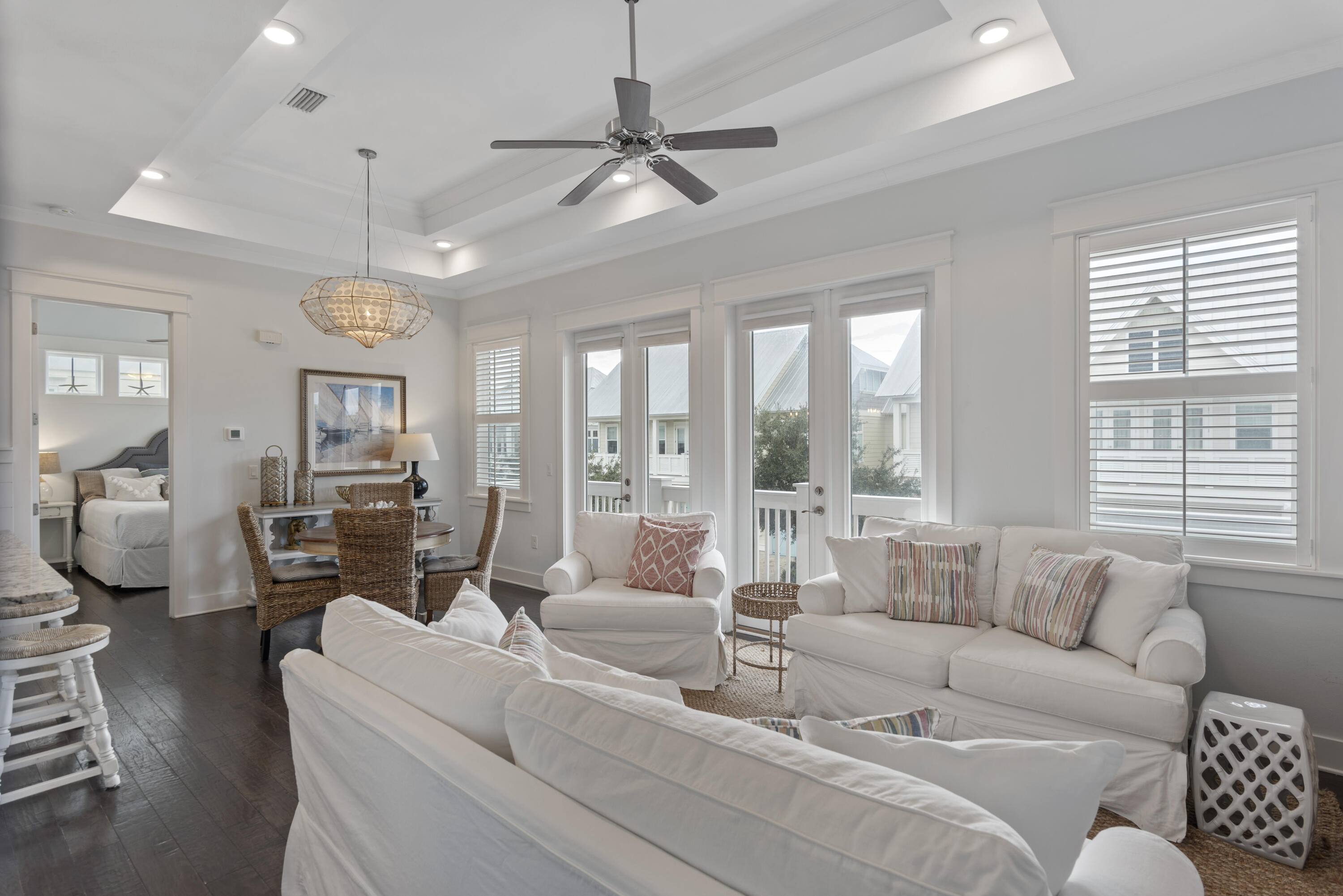 94 York Ln Inlet Beach, Unit C Inlet Beach, FL 32461 - Photo 10 of 36 a living room with furniture large window and a chandelier