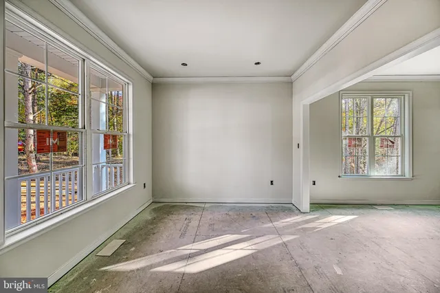 a view of room with window and ceiling fan