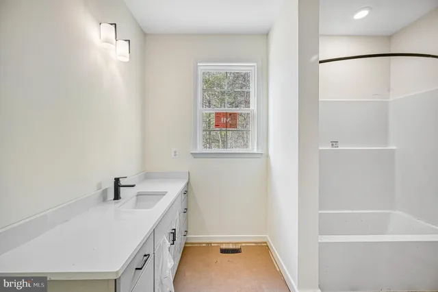 a view of a yard with trees in front of it