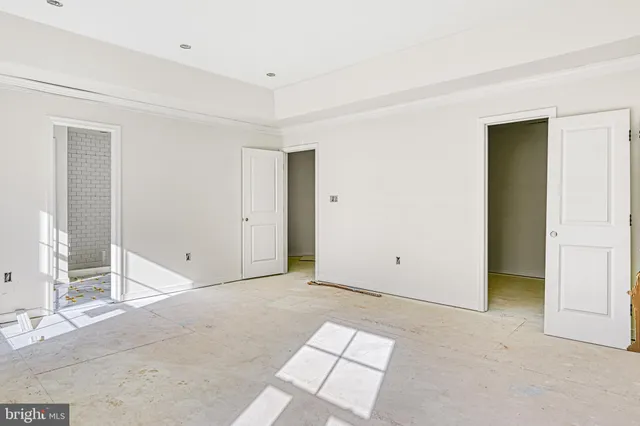 a view of a hallway with a white door