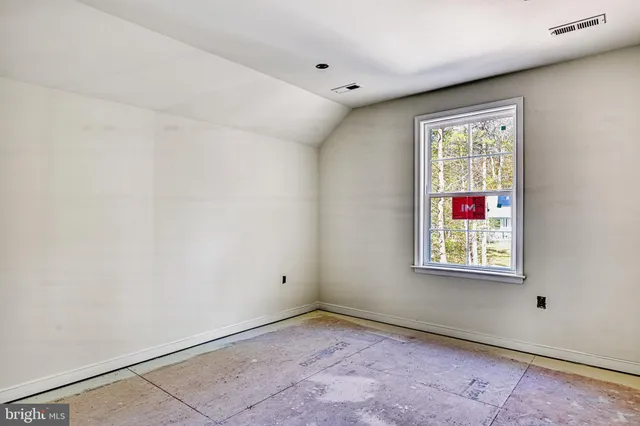 a view of a lake with chairs