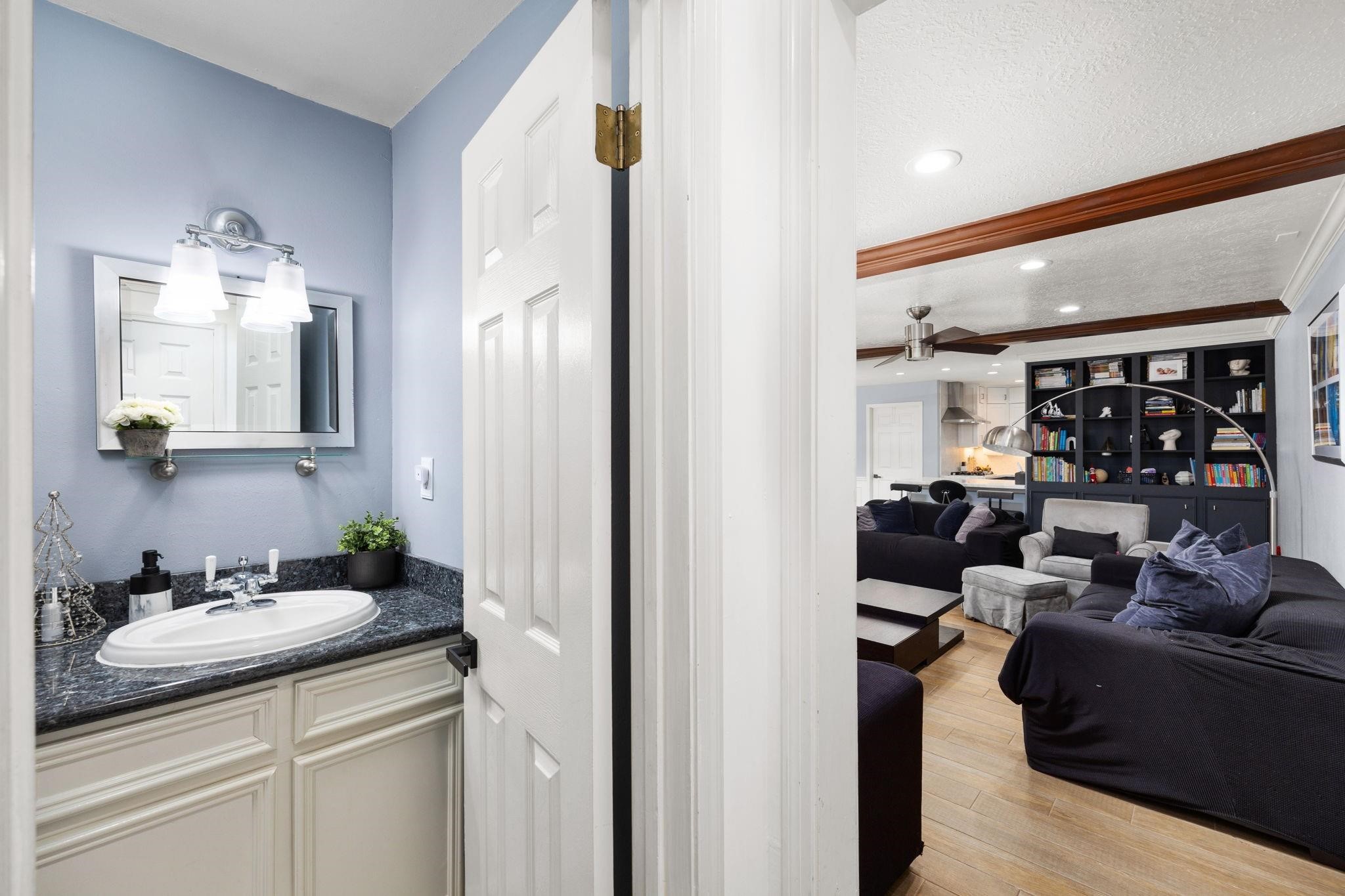 827 Thicket Lane Houston, TX 77079 - Photo 21 of 31 a living room with furniture and wooden floor