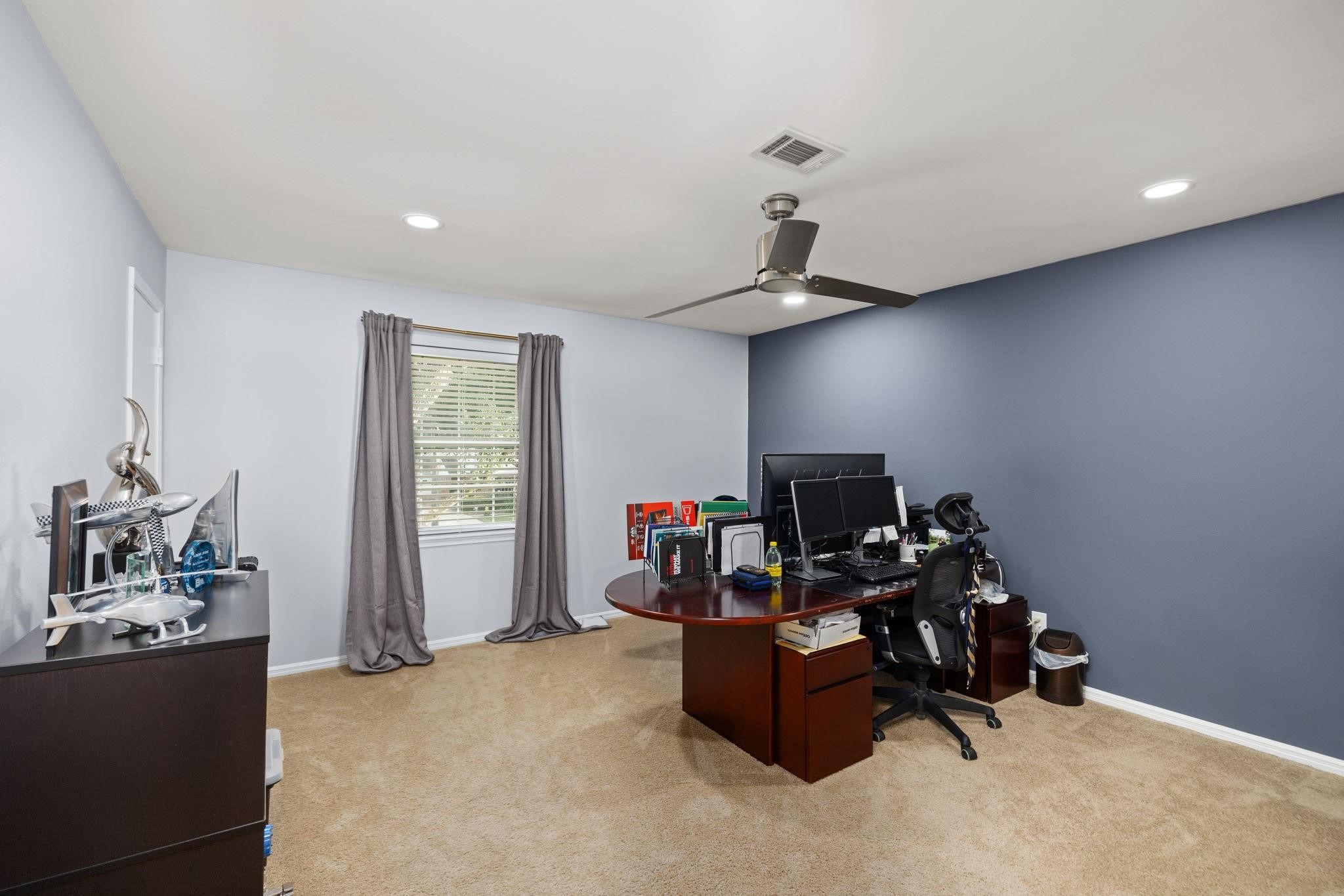 827 Thicket Lane Houston, TX 77079 - Photo 22 of 31 a view of a workspace with furniture