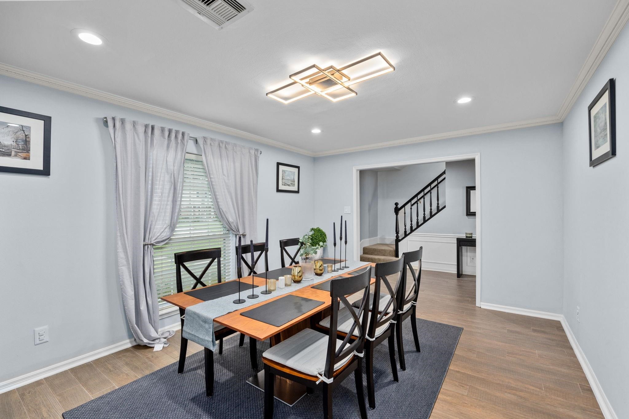 827 Thicket Lane Houston, TX 77079 - Photo 7 of 31 a dining room with furniture and window