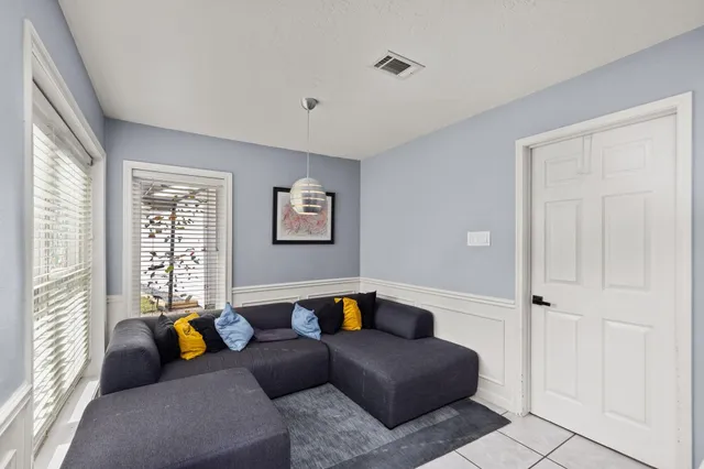 a living room with furniture and a window