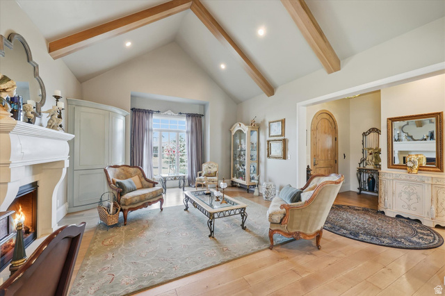 930 Price Farm Court Midway, UT 84049 - Photo 12 of 42 Living area featuring quarter sawn white oak flooring, vaulted ceiling, and fireplace