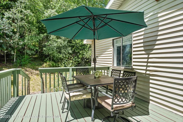 a view of balcony with outdoor seating and wooden floor